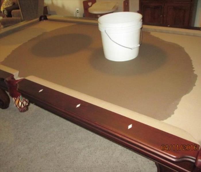 Billiard Table Soaked with Water from a Leak